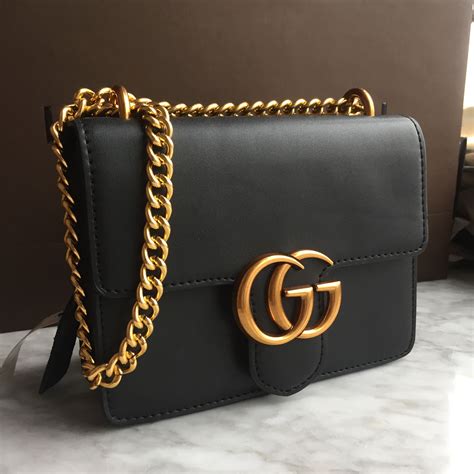 black gucci purse with gold chain